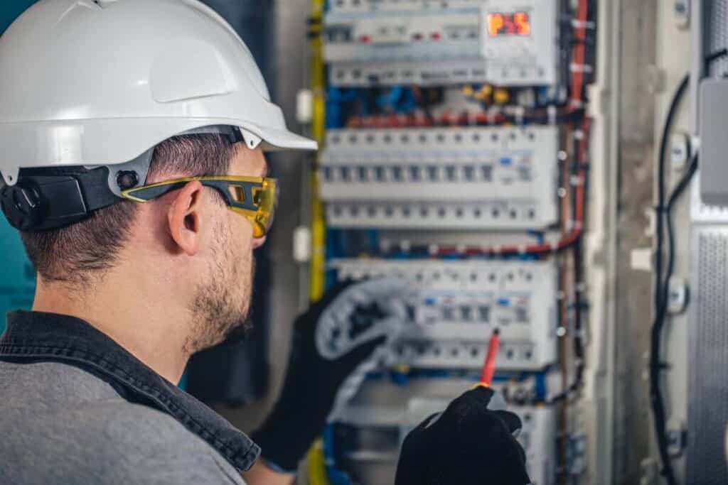 Commercial Electrician West Leederville inspecting electrical circuit break at Bassendean business