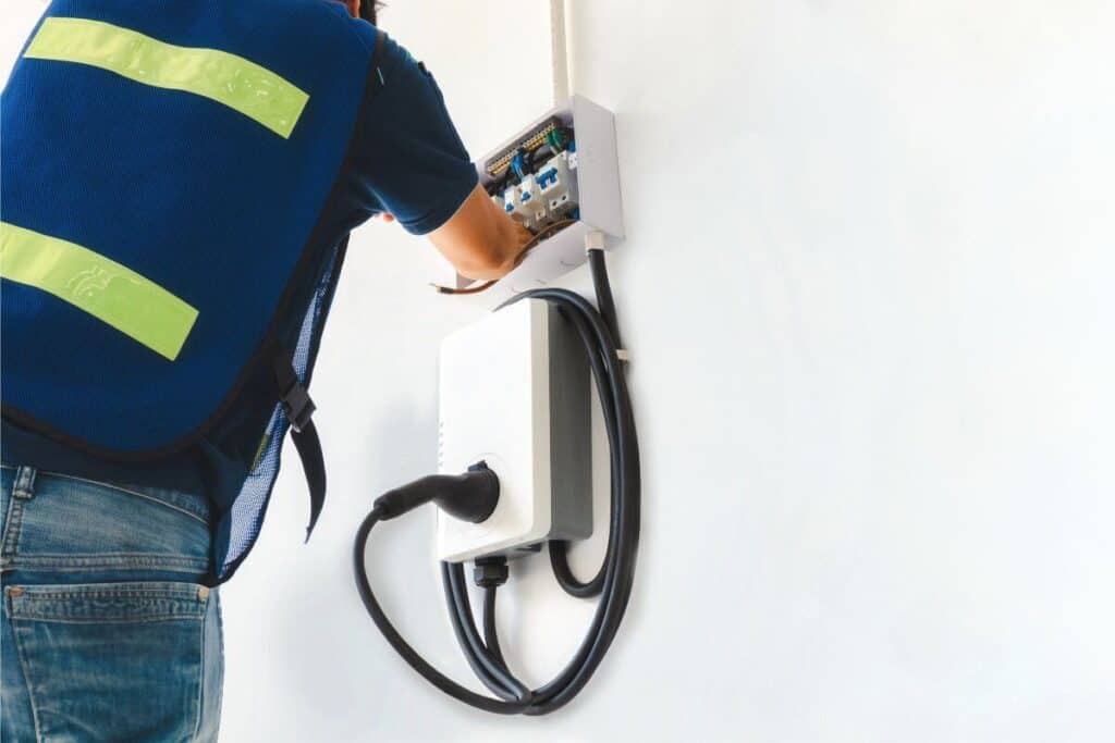 Residential Electrician Near Me installing wall-mounted EV charging unit at Mount Lawley Home
