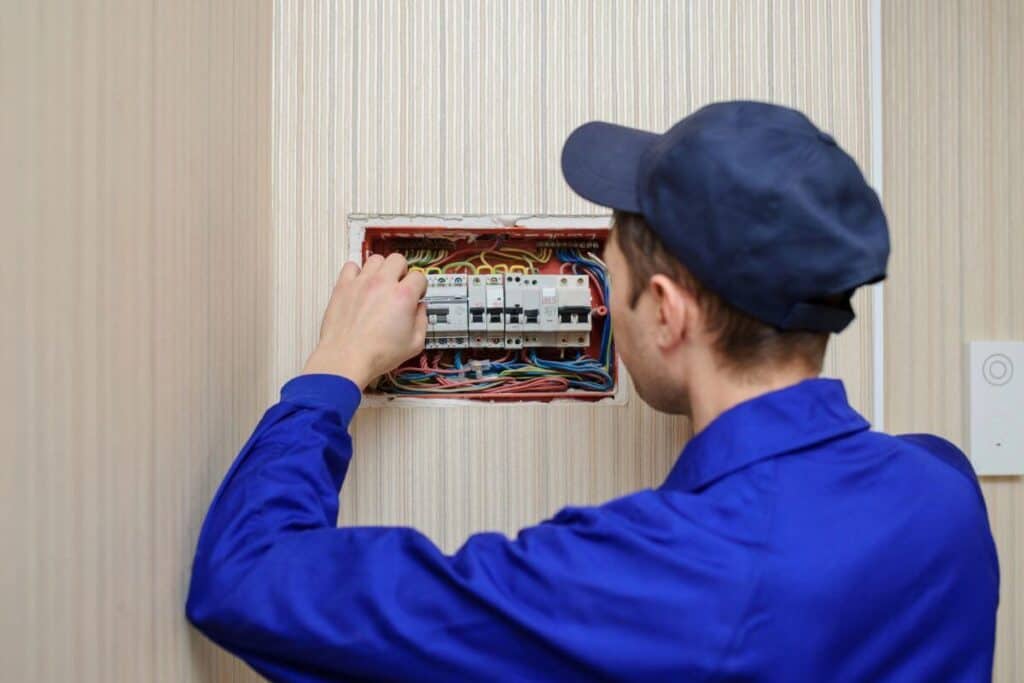 Residential Electrician Perth inspecting and upgrading fuse panel at a home in Thornlie