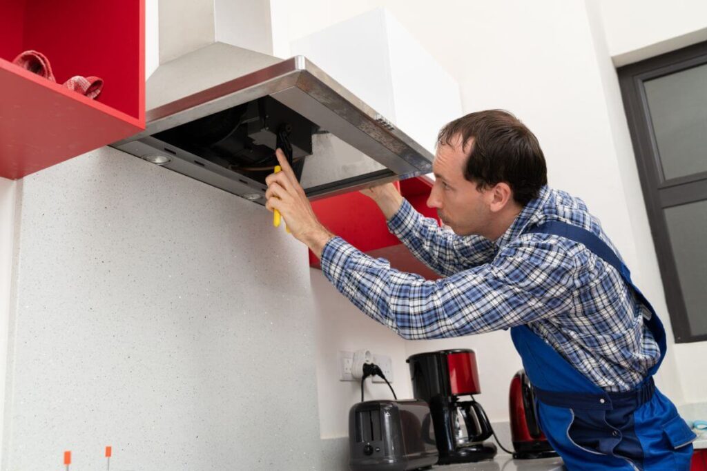 Home electrician Perth servicing and testing range hood exhaust in Cannington home